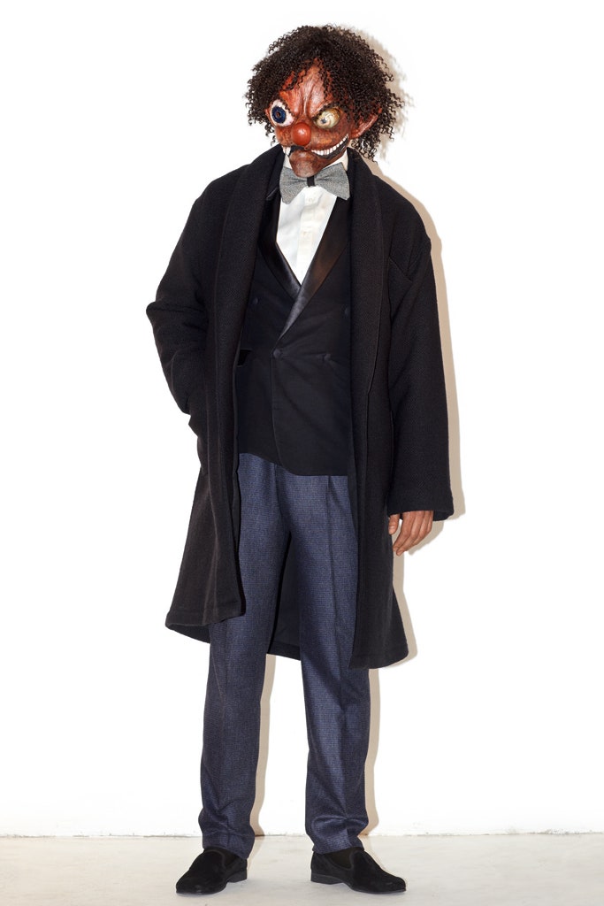 black wool coat and blazer with blue pants