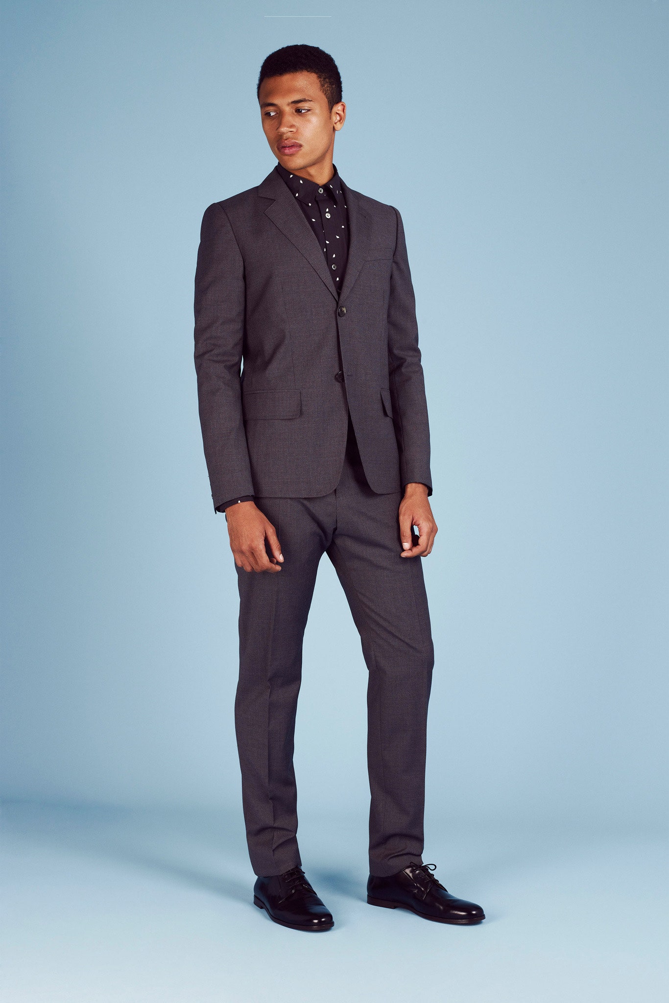 gray tailored suit with black shirt