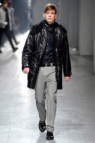 black vinyl coat with tailored pants