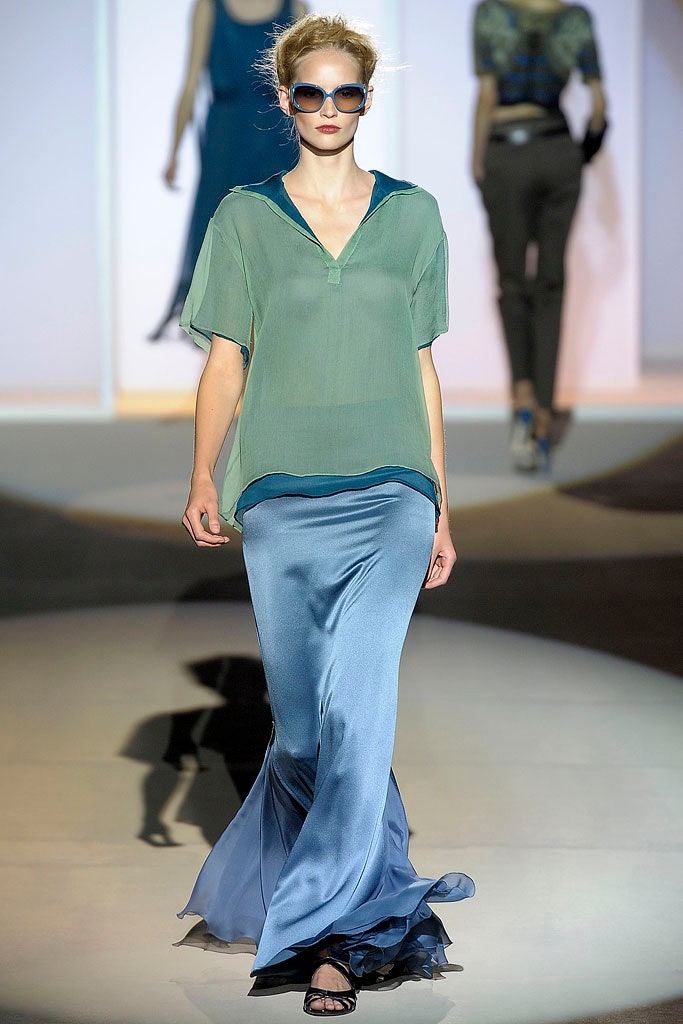 green layered top with blue flared skirt