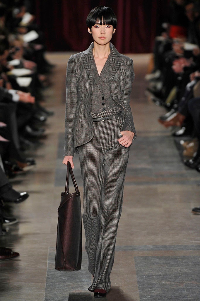 gray tailored suit with bag