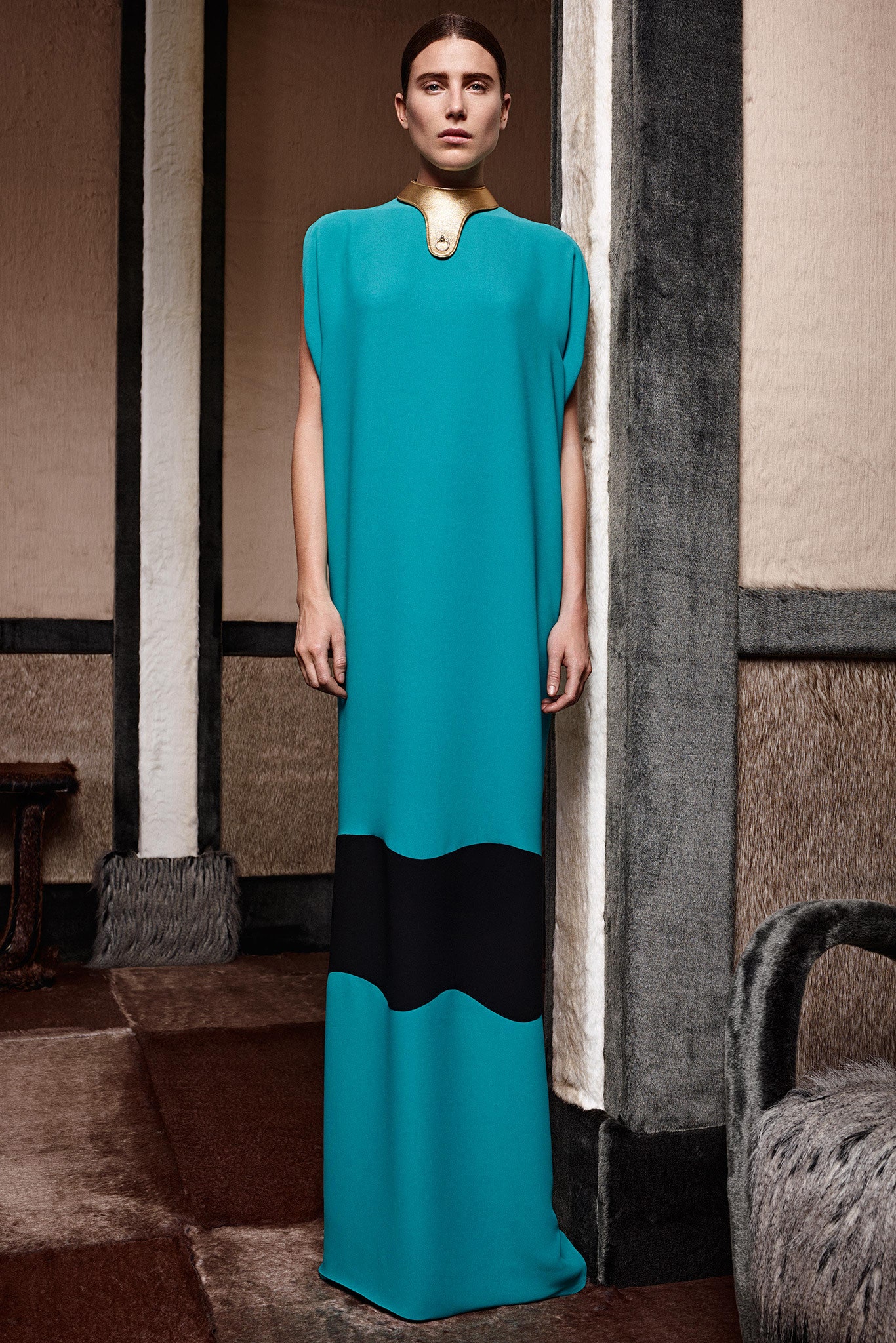 teal and black draped gown