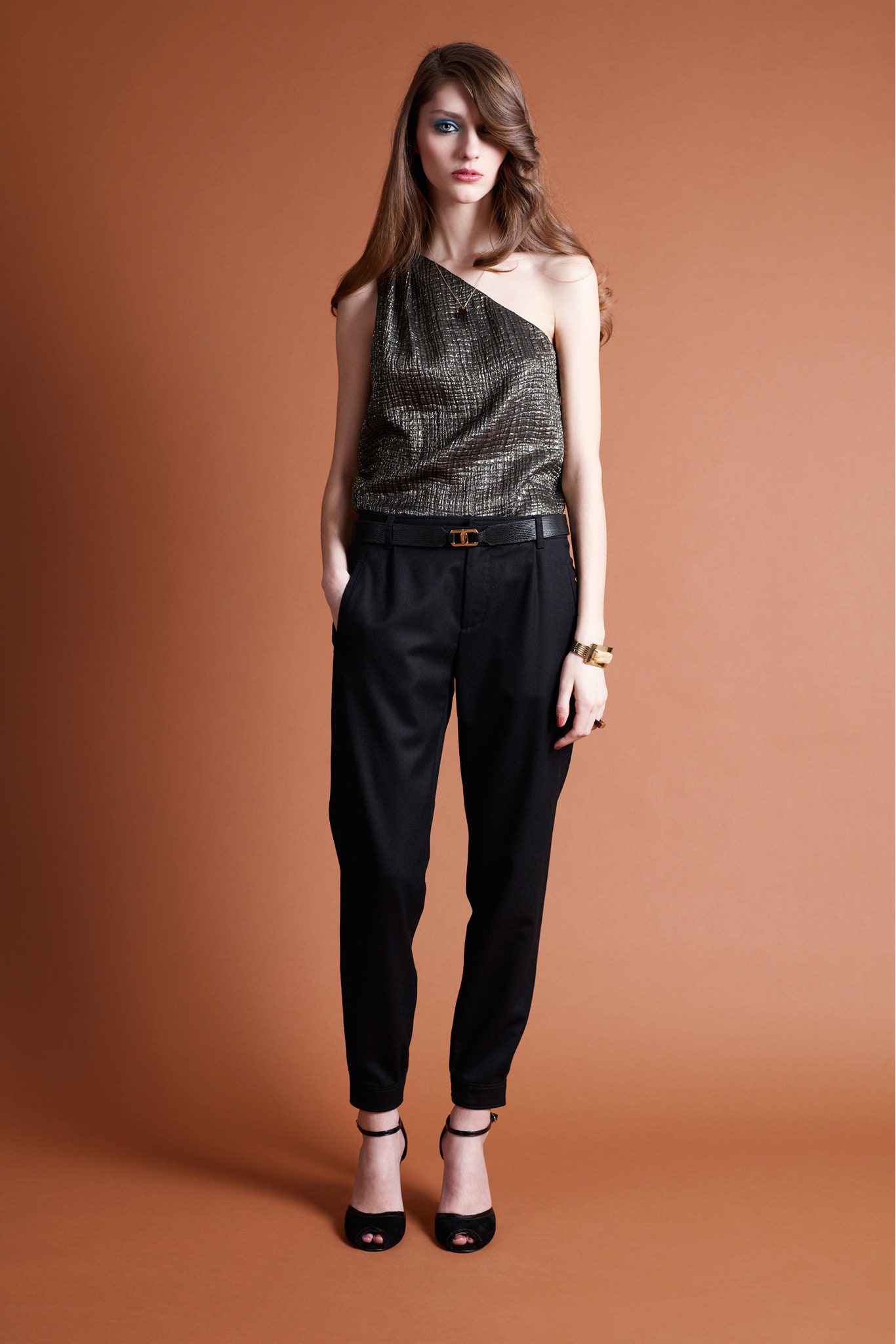 asymmetric black and gold top with relaxed pants
