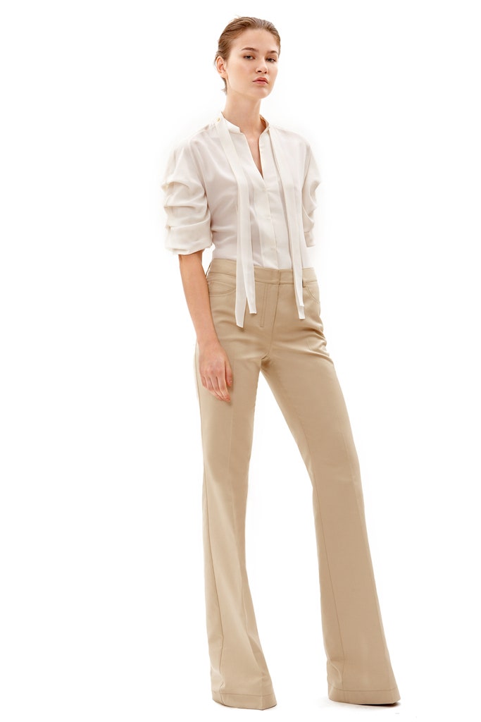 white fitted shirt and beige flared pants