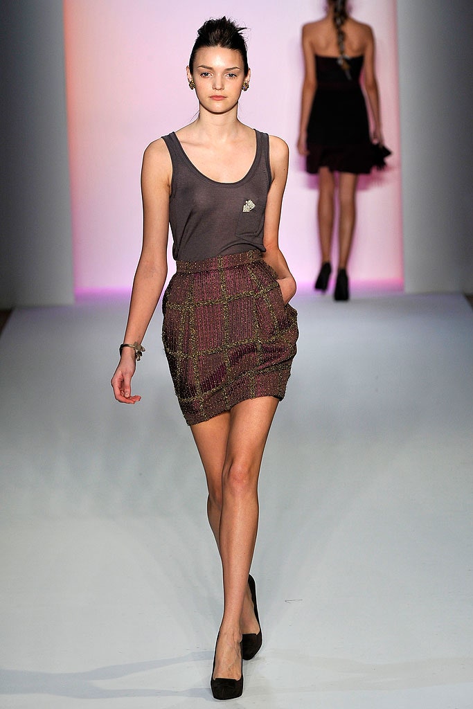 gray sleeveless top with purple mini skirt