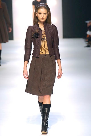 brown fitted jacket with gold blouse