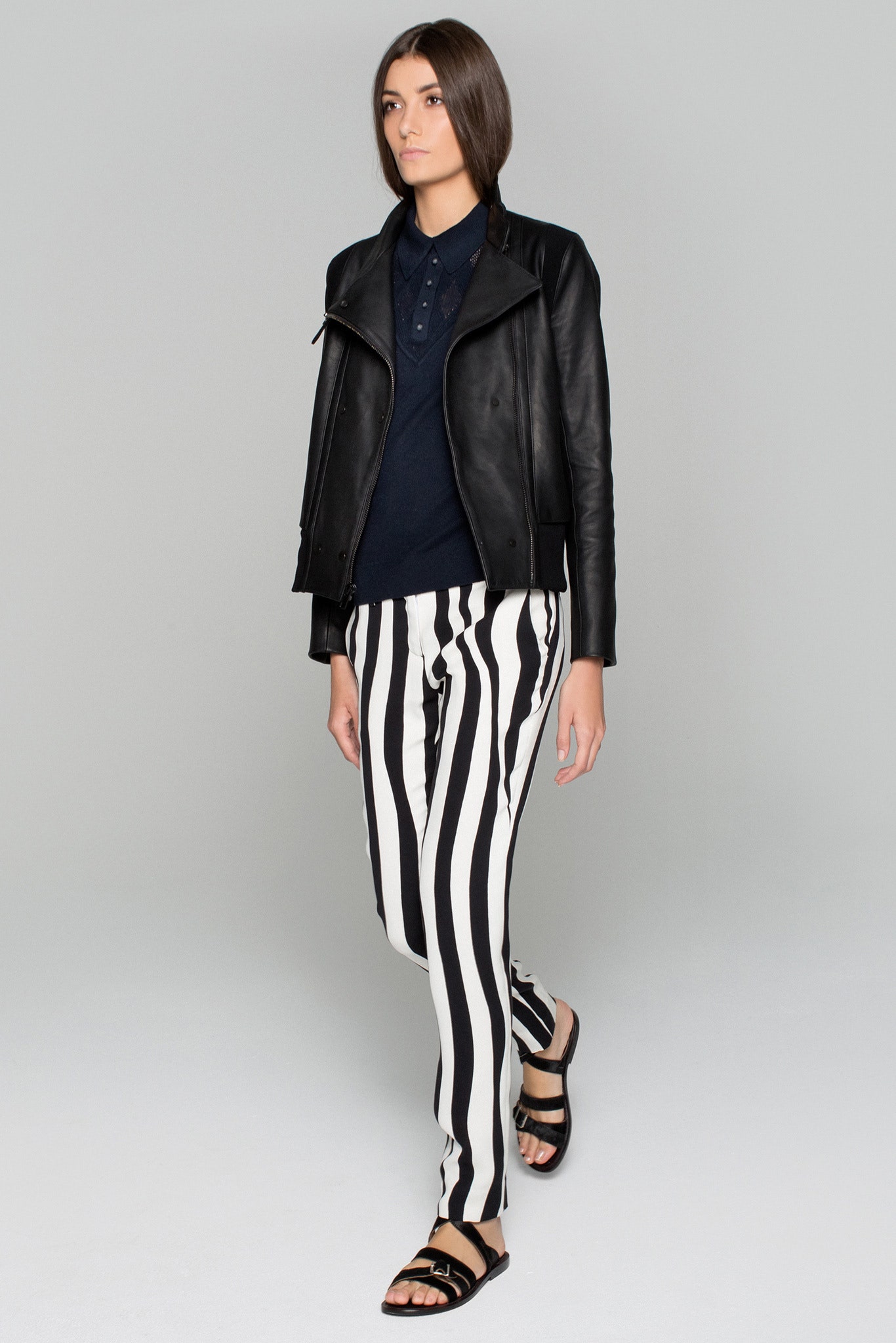 black leather fitted jacket with striped pants
