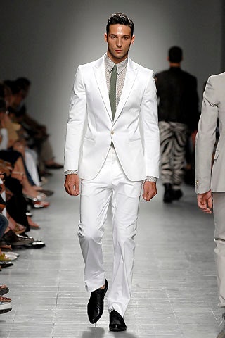 white tailored suit with green tie