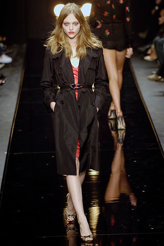 black trench coat and red dress