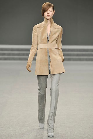 beige suede fitted coat and gray tailored pants