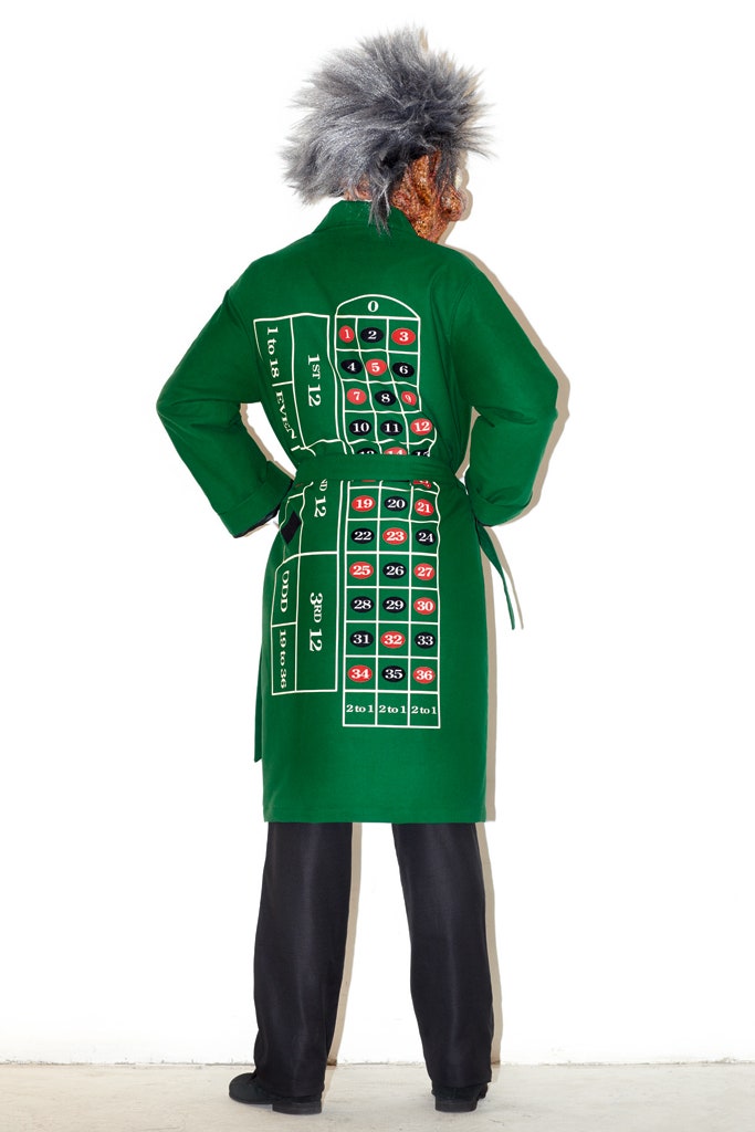 green printed coat with black pants