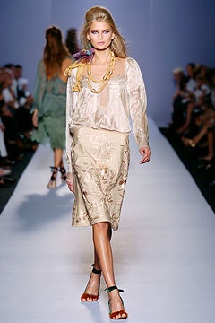 beige silk blouse and gold midi skirt