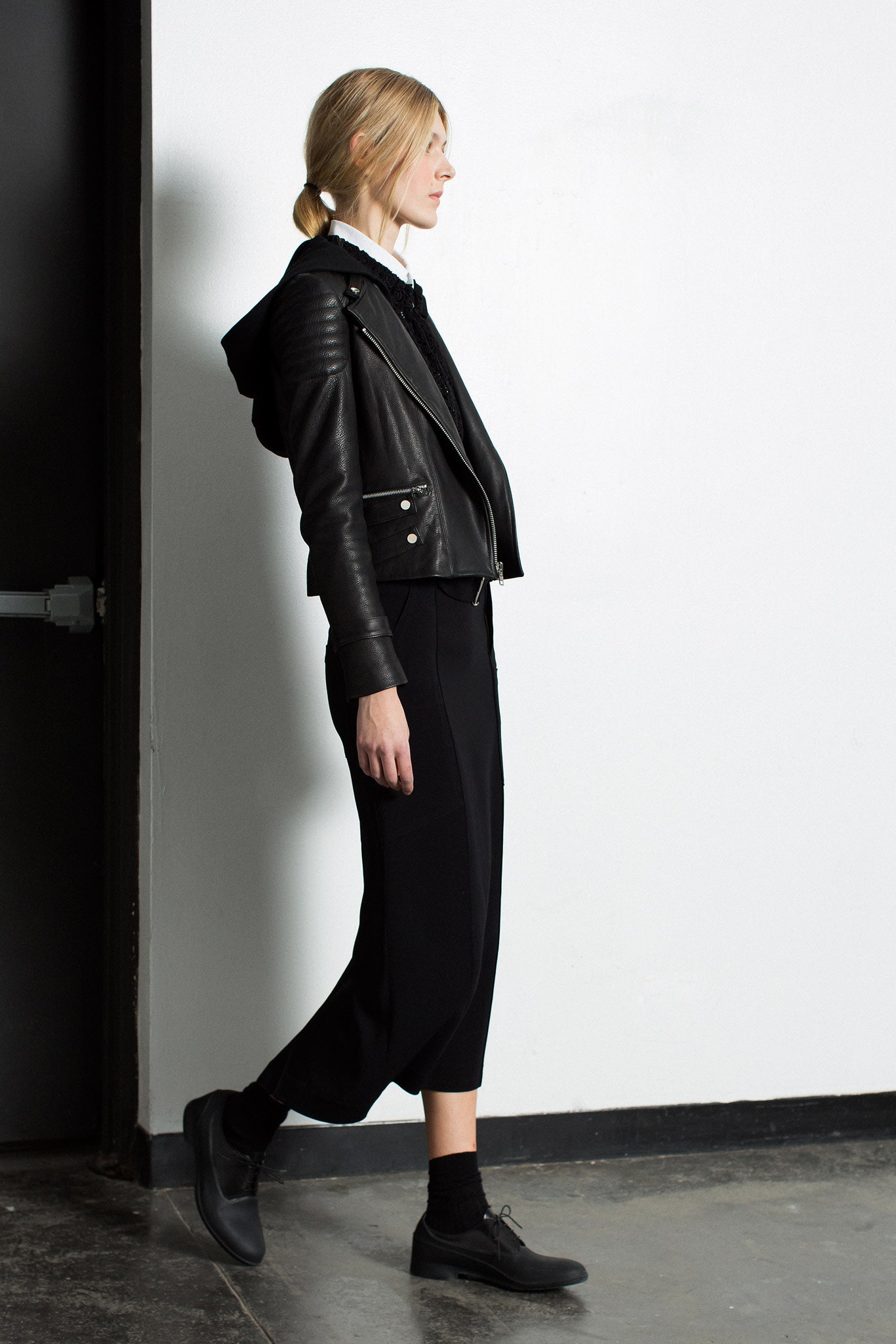 black leather jacket and relaxed pants