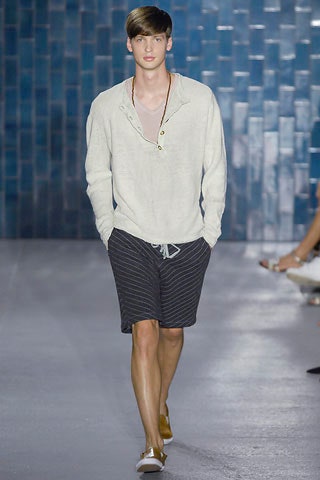 white relaxed shirt and black shorts