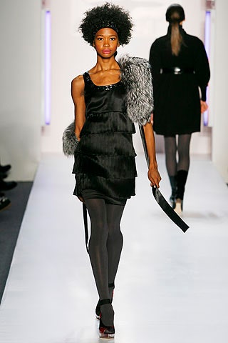 black silk layered dress with gray fur cape