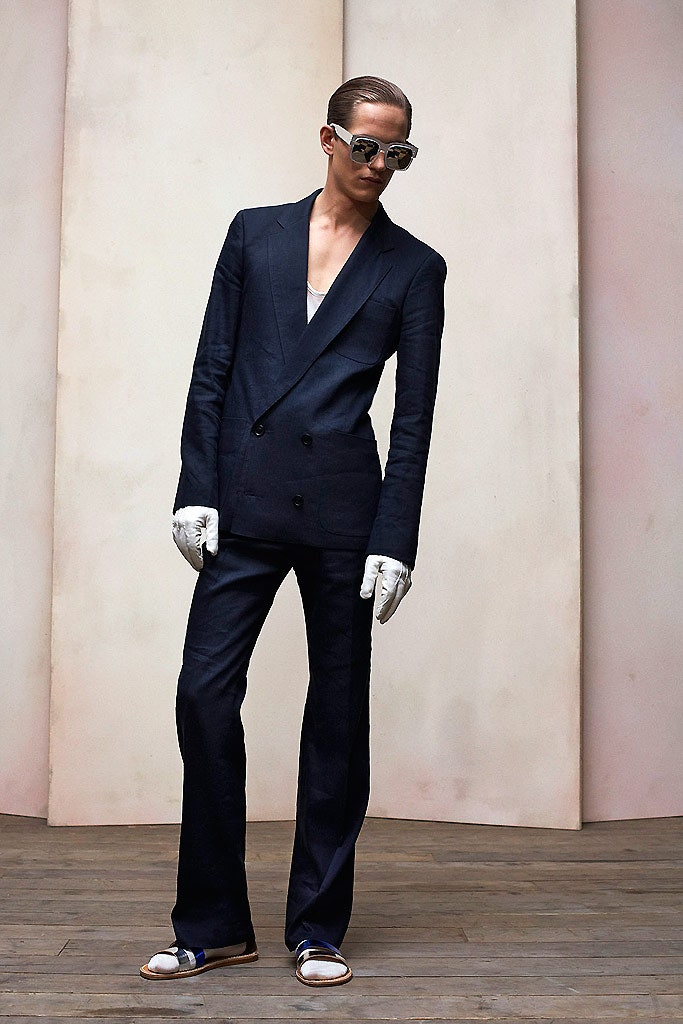 black tailored suit with white accessories