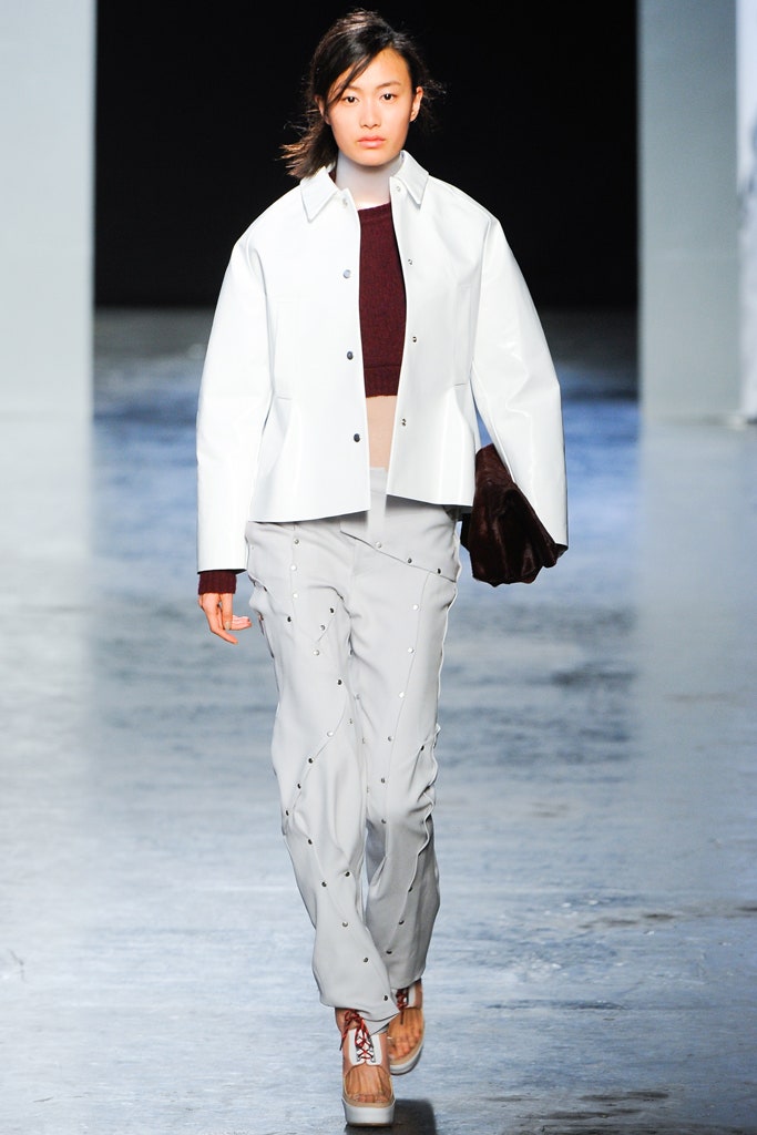 white leather jacket with gray pants