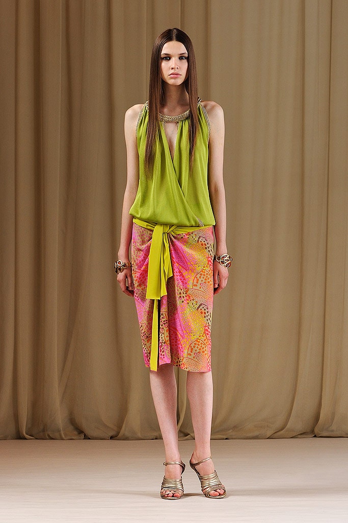 green draped top with pink skirt