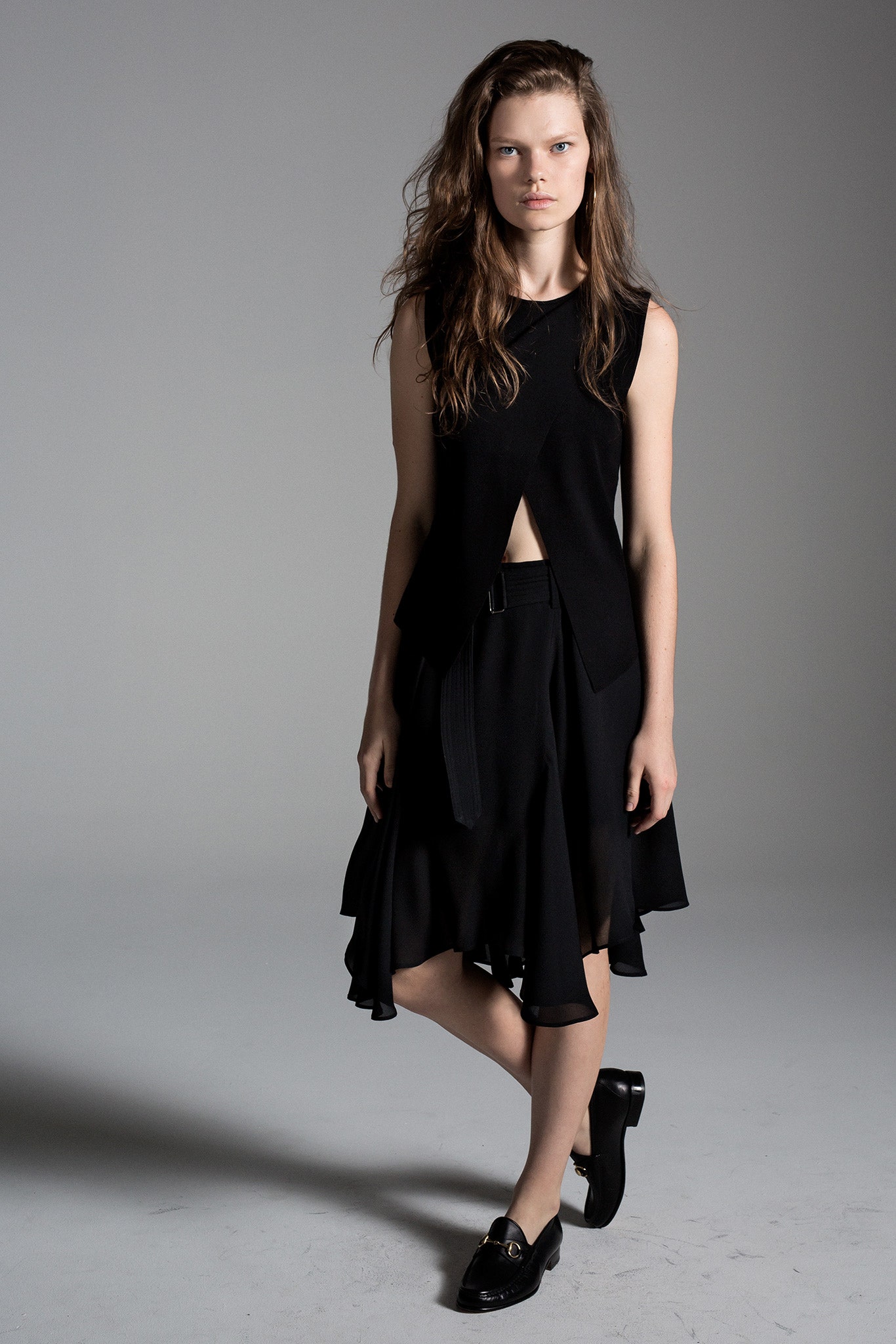 black fitted top and flared skirt