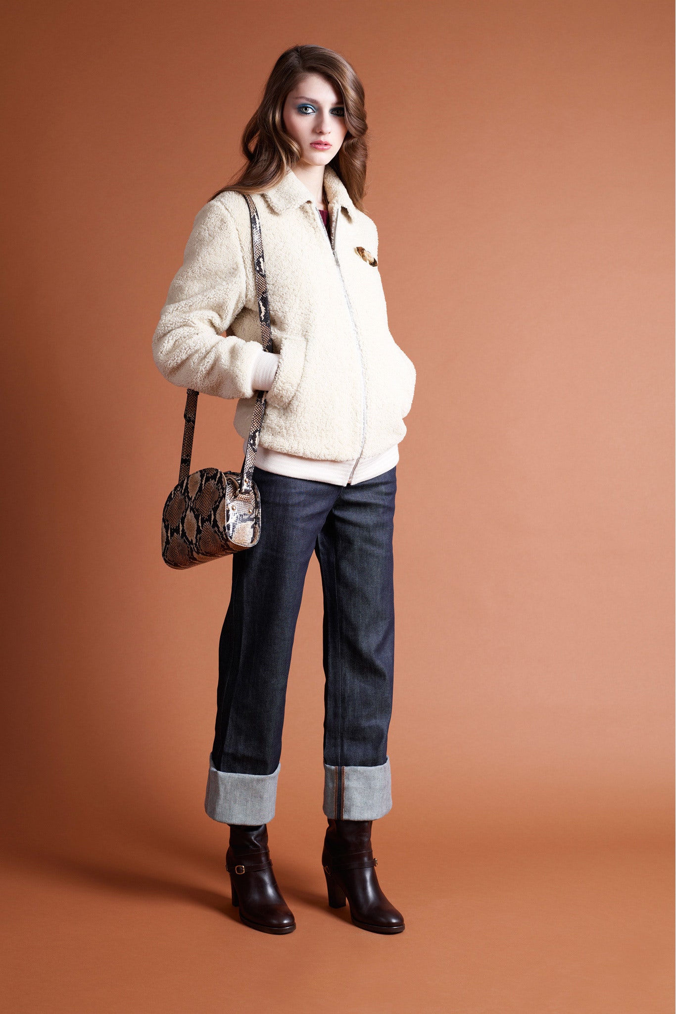 beige faux-fur jacket with denim pants