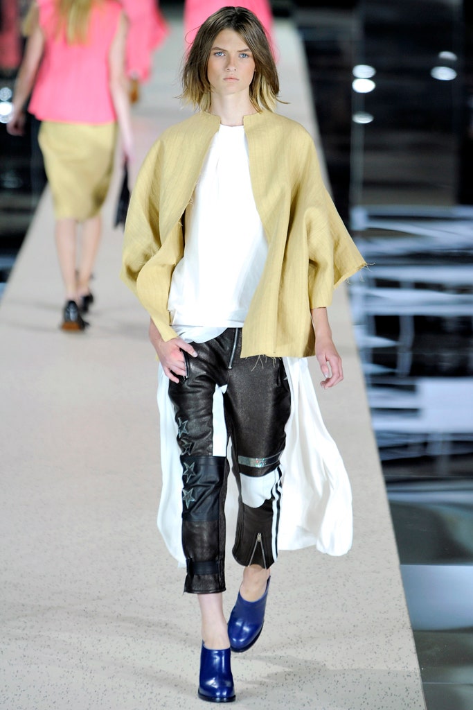 white relaxed top with black leather pants