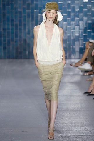 white silk fitted top and beige skirt