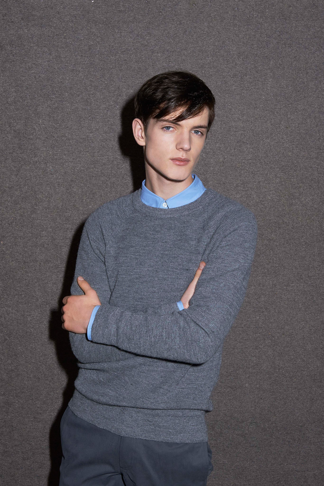 gray wool sweater with blue shirt