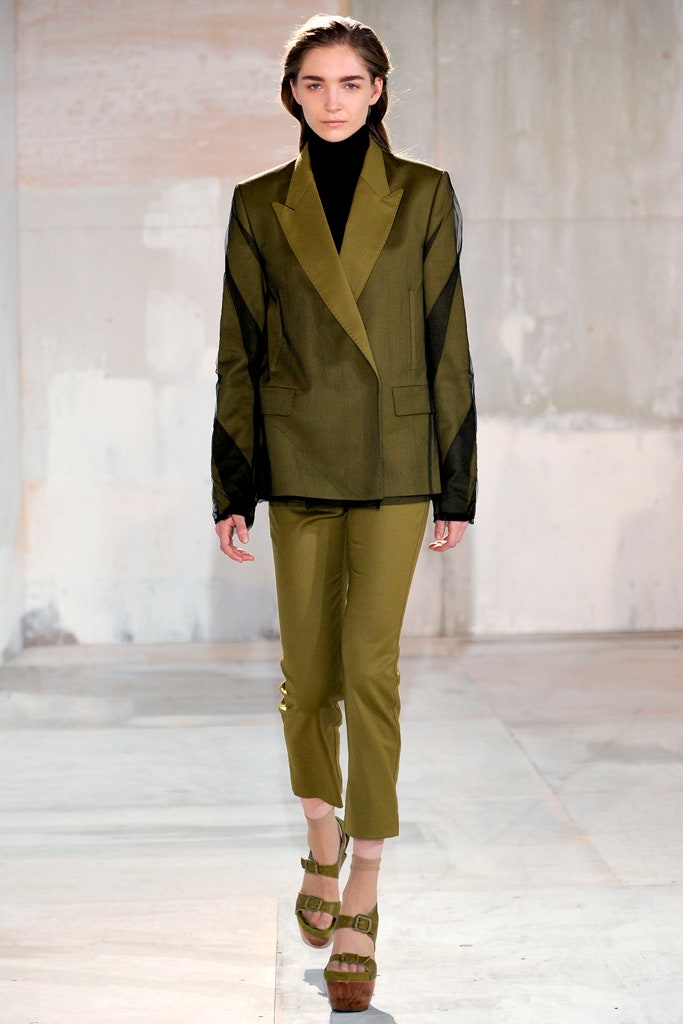 green tailored blazer with slim pants
