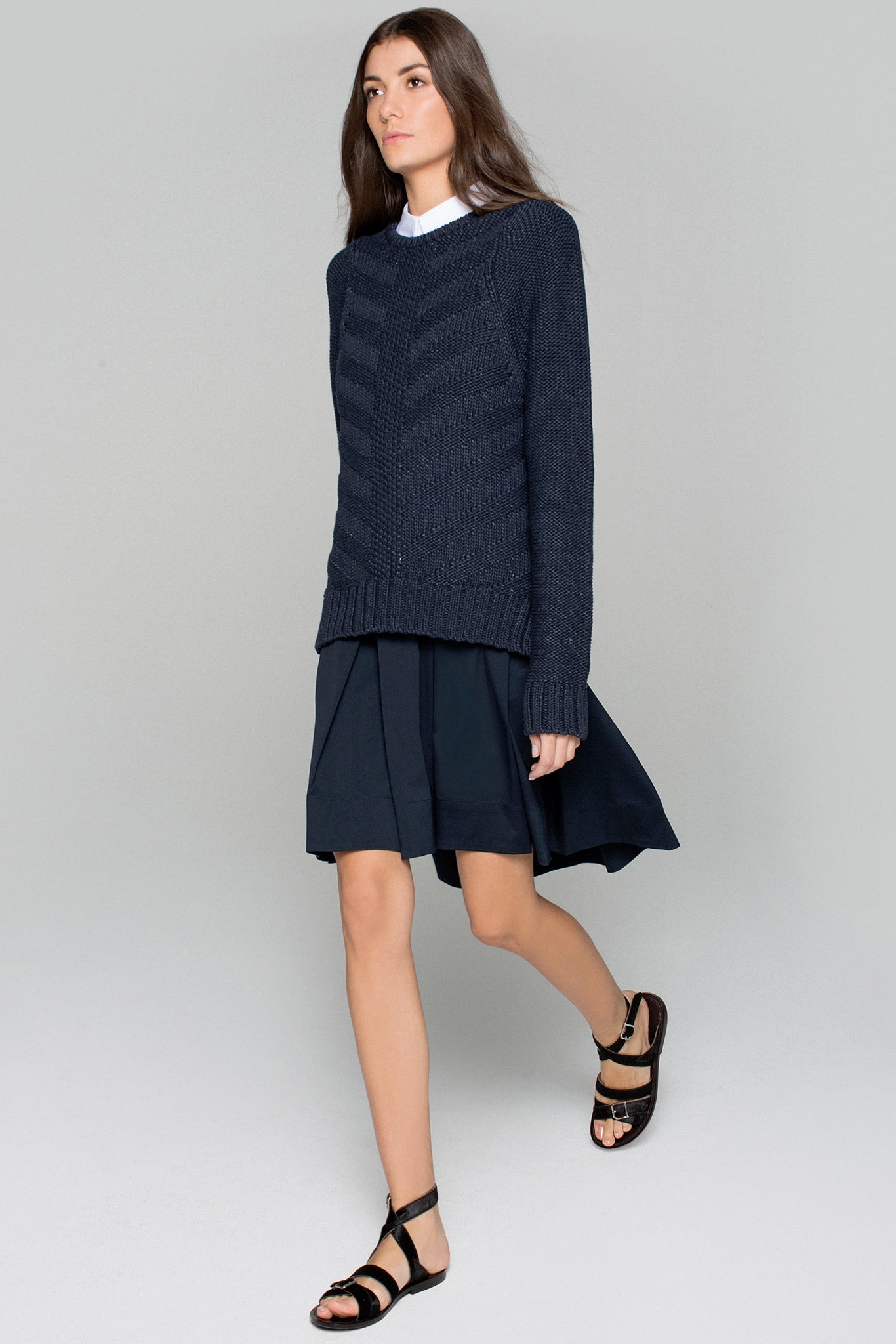 blue wool relaxed sweater and black midi skirt