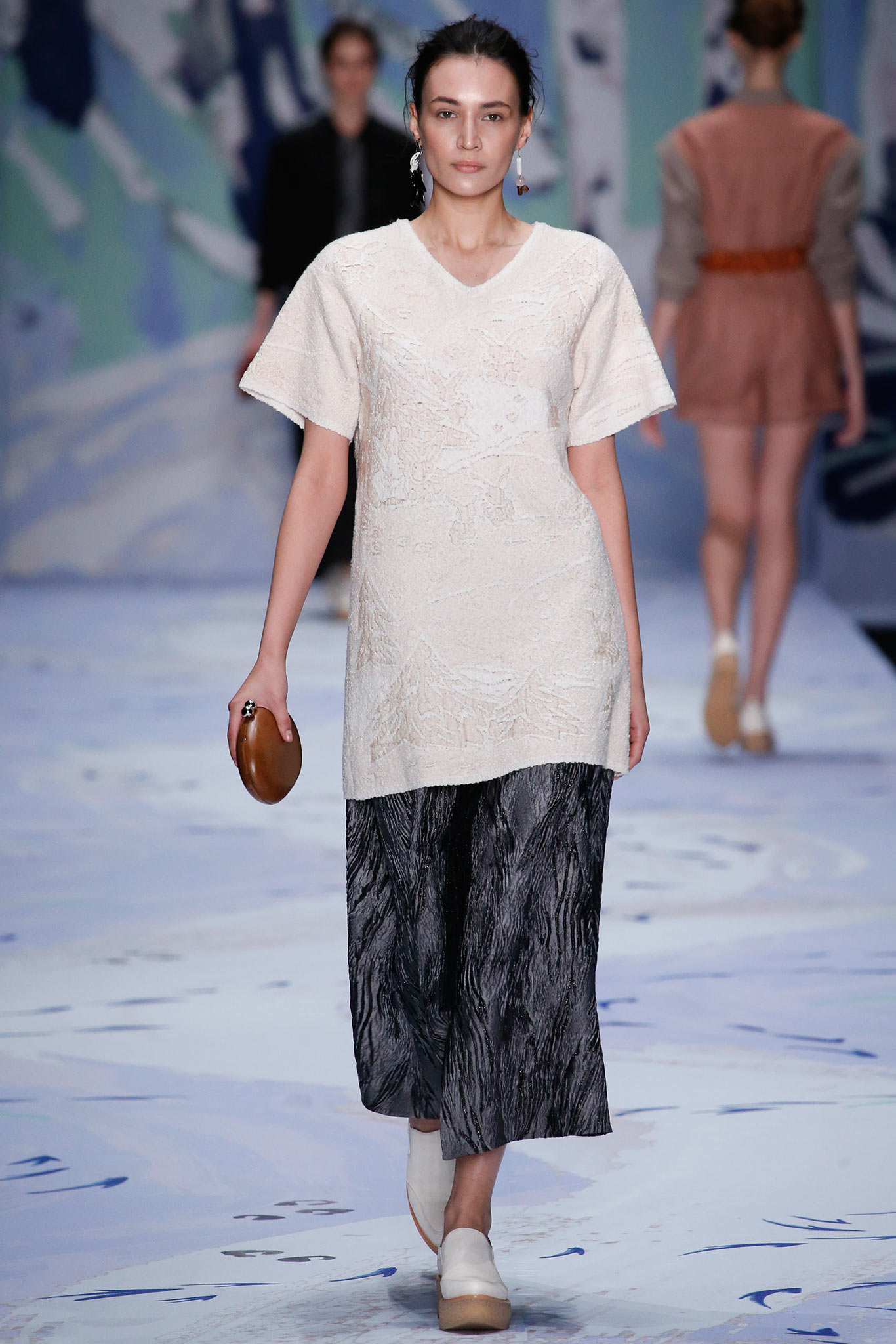 white embroidered top with black pants
