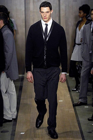 black fitted cardigan and gray tailored pants