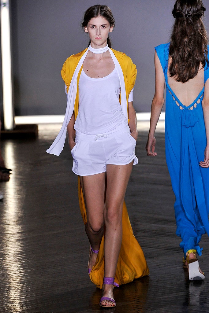 white sleeveless high-neck fitted top