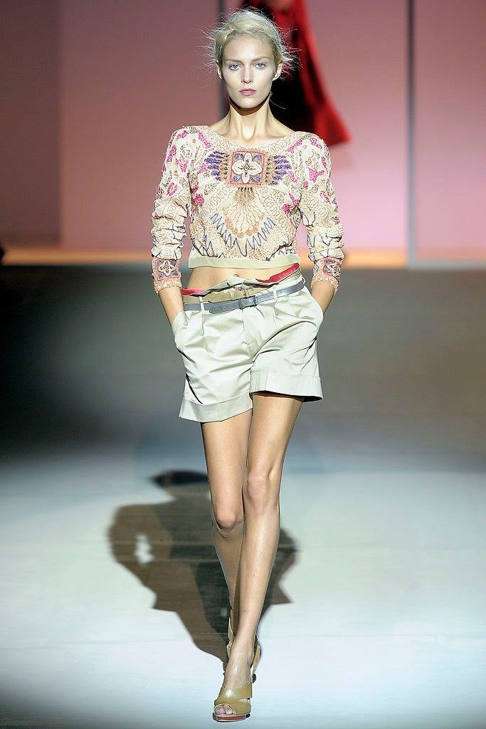embroidered pink top with beige shorts