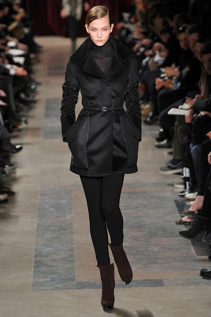 black fitted coat with straight-leg pants