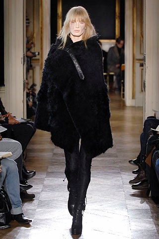 black fur poncho with fitted pants