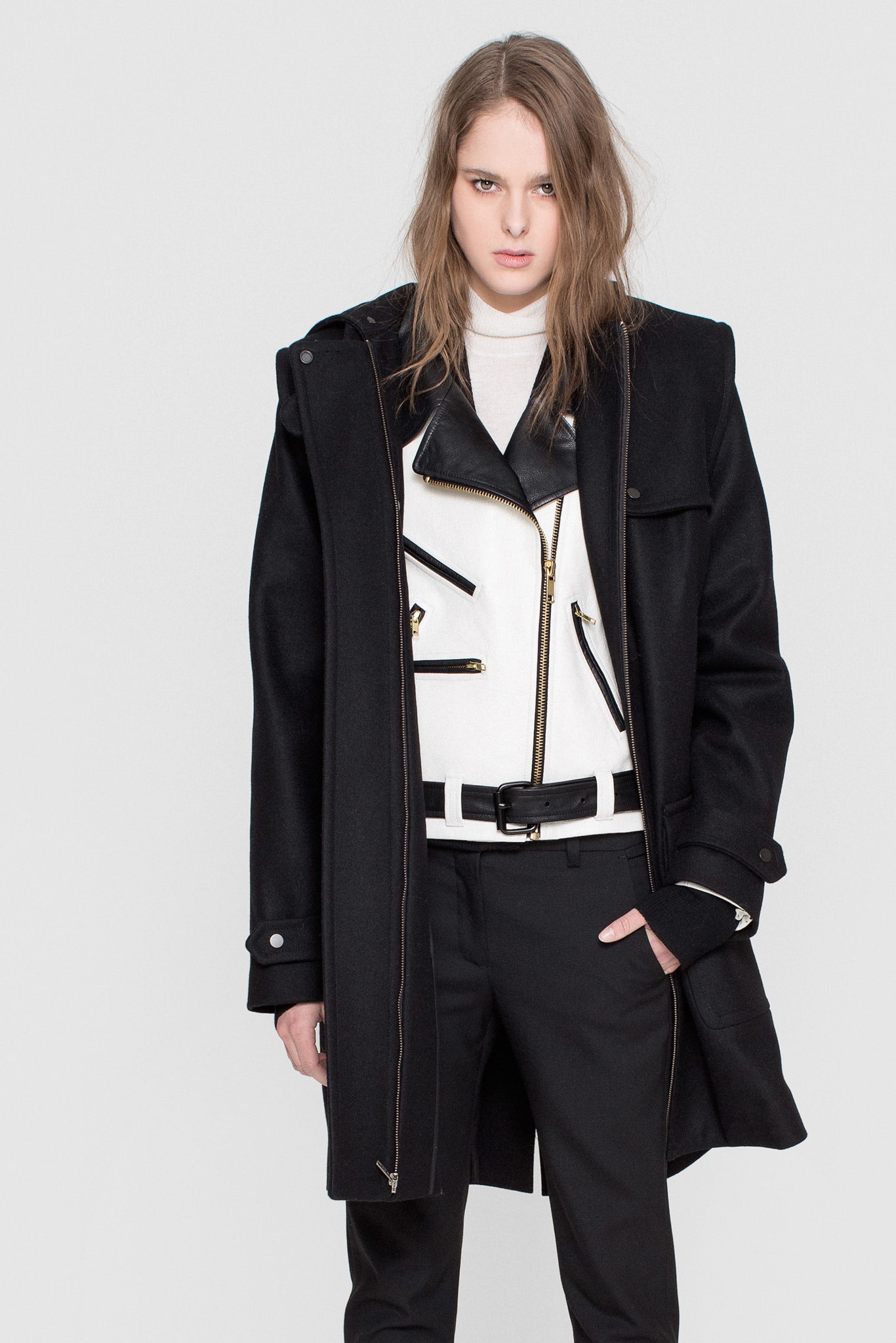black wool coat and leather jacket