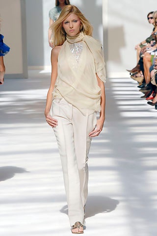 beige silk sleeveless high-neck fitted draped flowing top