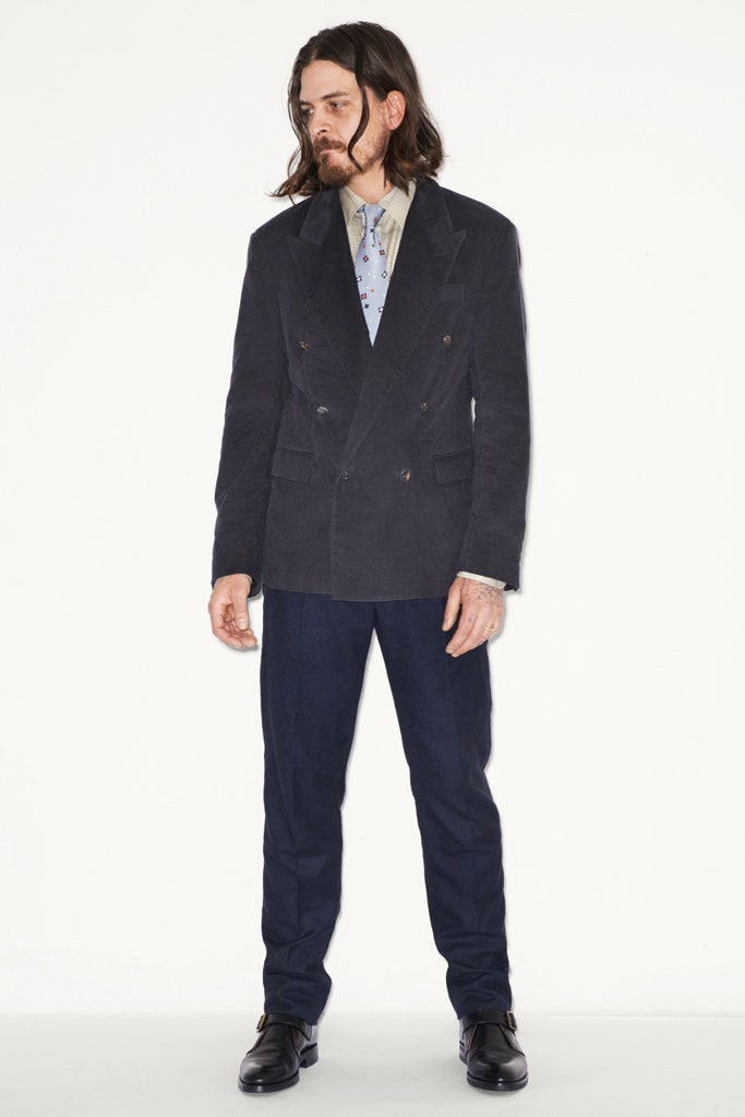black tailored blazer with blue pants