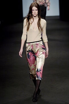 beige silk fitted top and pink gold flared pants