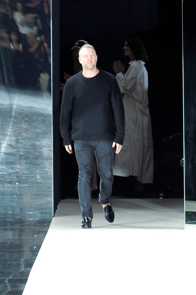 black relaxed sweater with slim pants