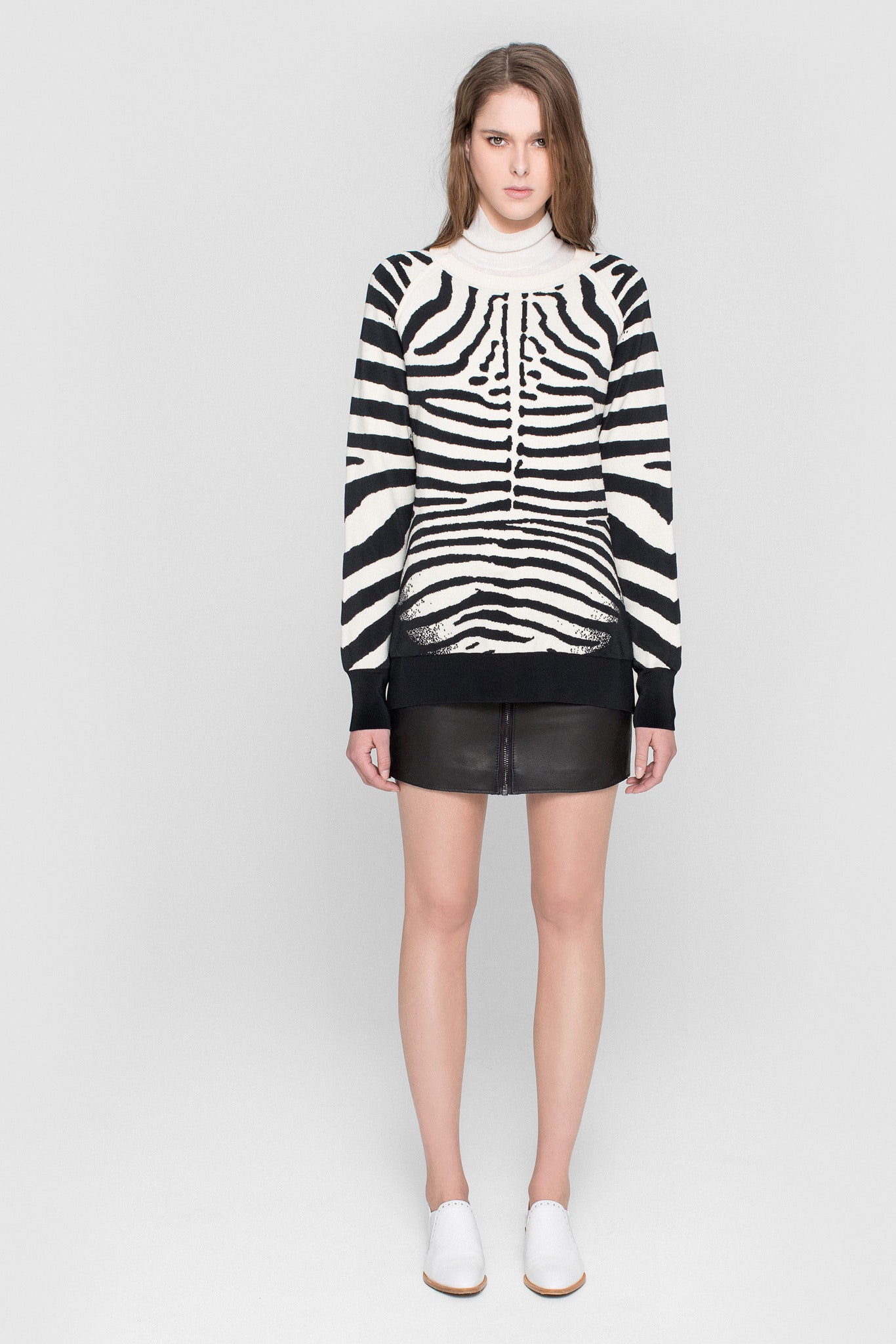 black and white striped sweater with leather mini skirt