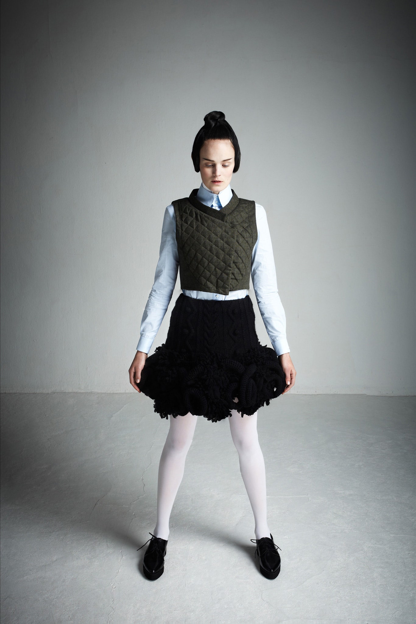 white collared top green quilted vest