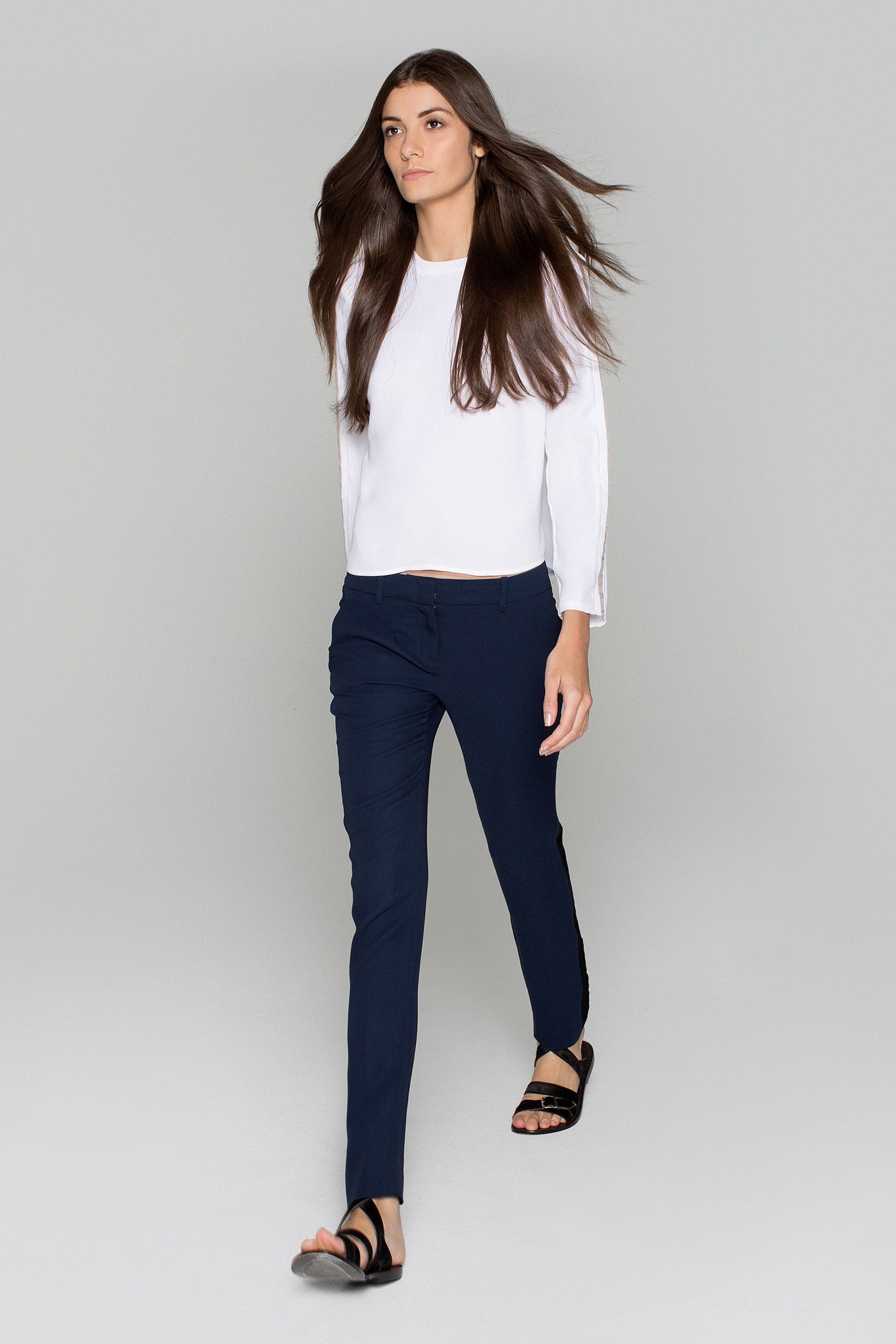 white fitted top with blue pants
