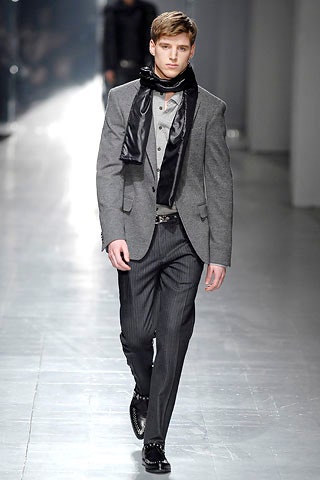 gray tailored suit with black scarf
