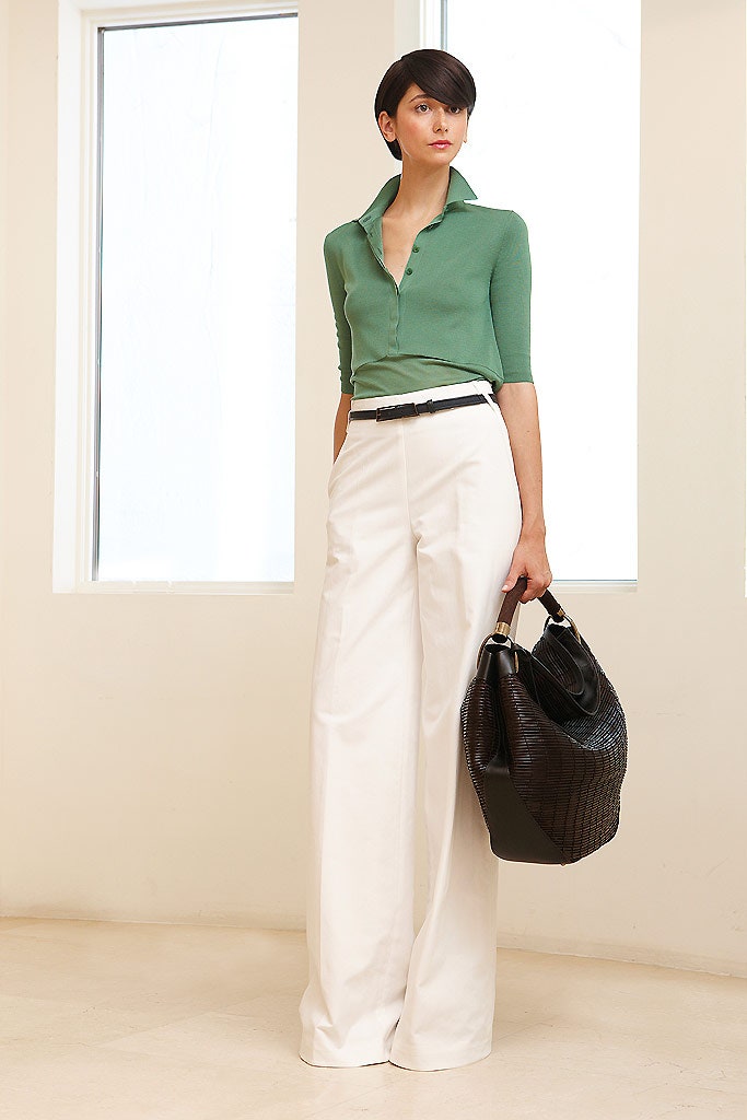 green fitted top with white pants