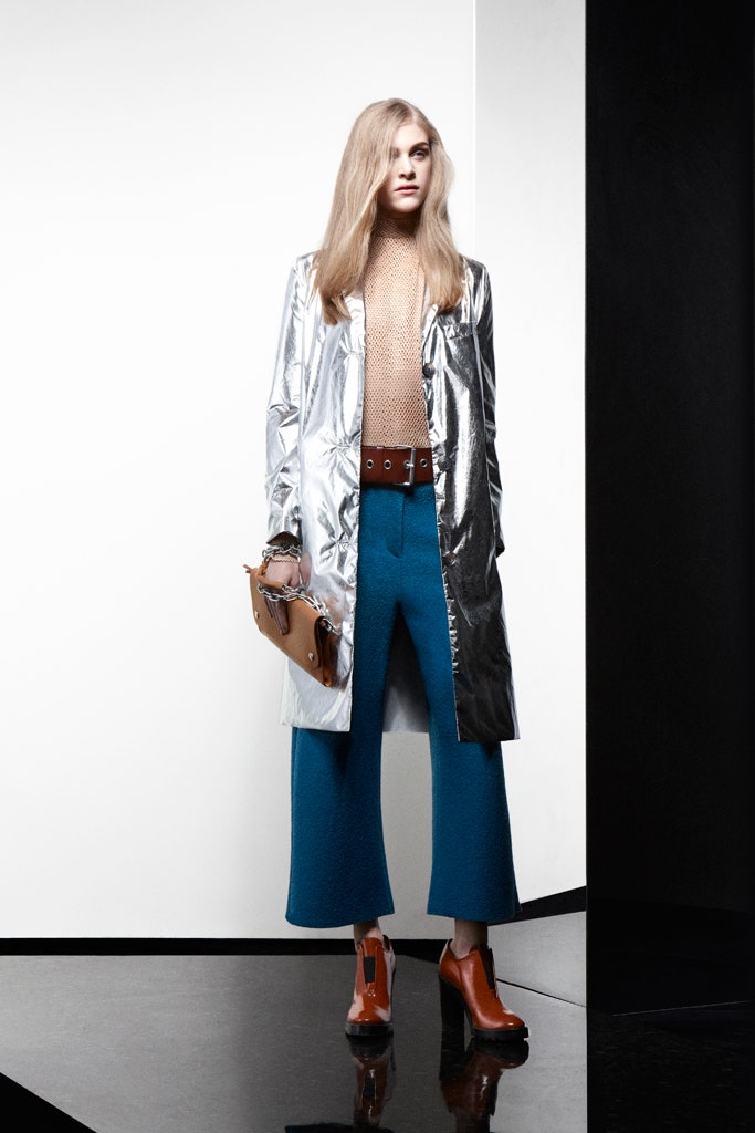 silver coat beige knit top blue tailored pants