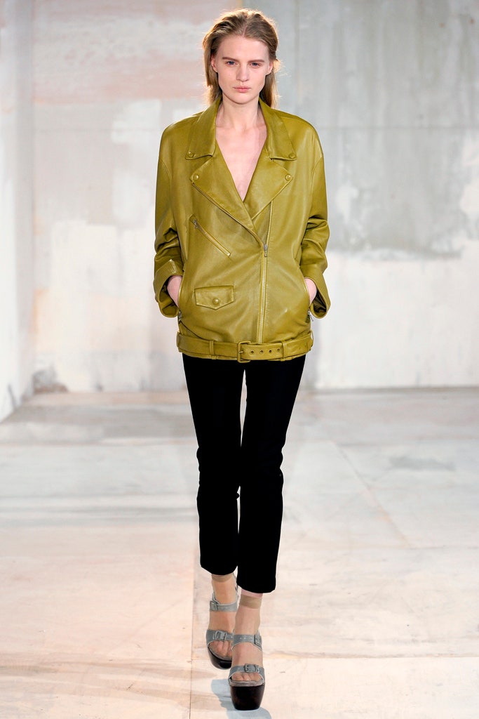 green leather fitted jacket with black pants