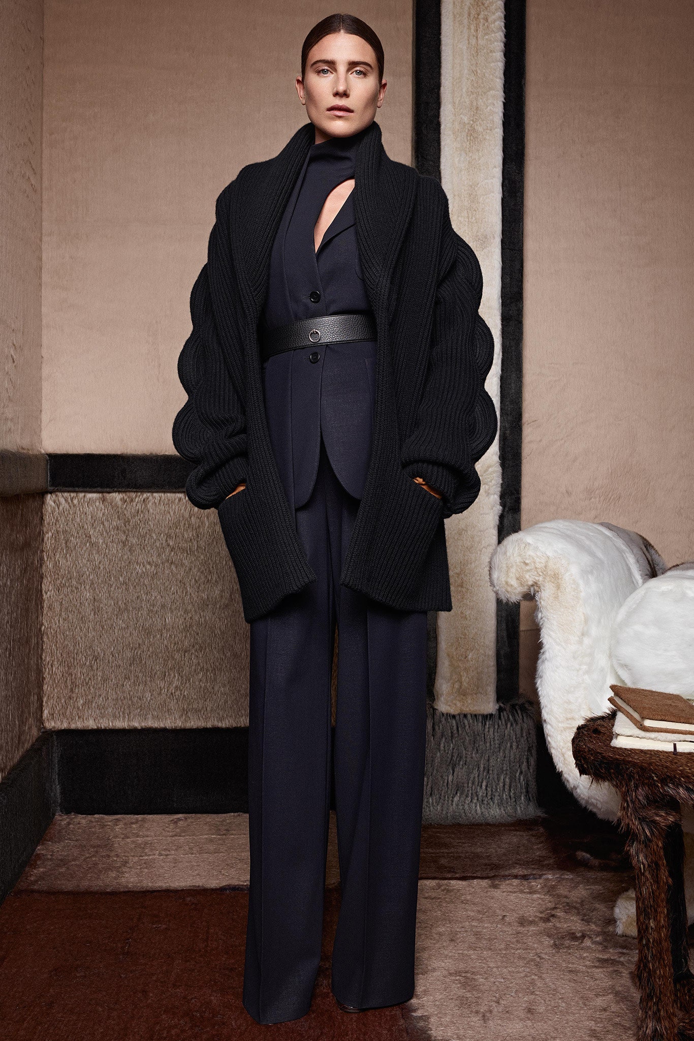 black oversized coat and tailored suit