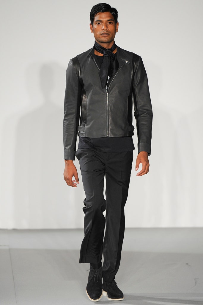 black leather fitted jacket and tailored pants