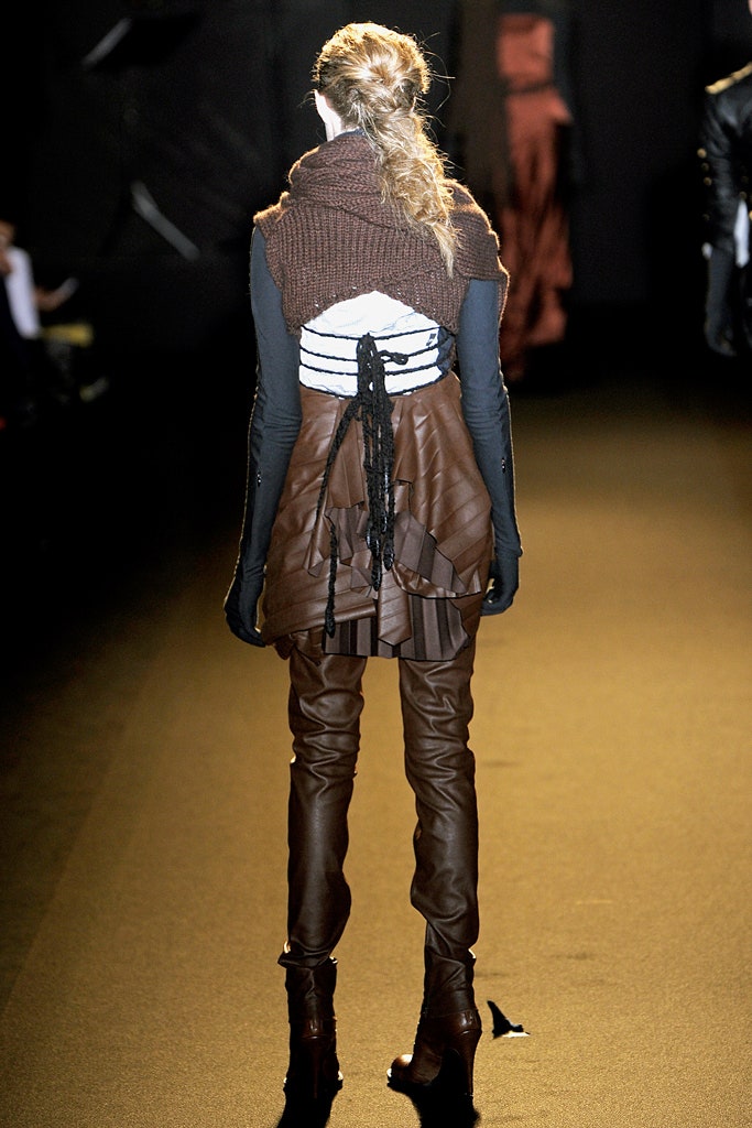 black and brown layered top with fitted pants